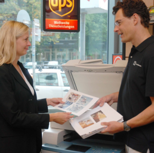 workers handing out printed paper